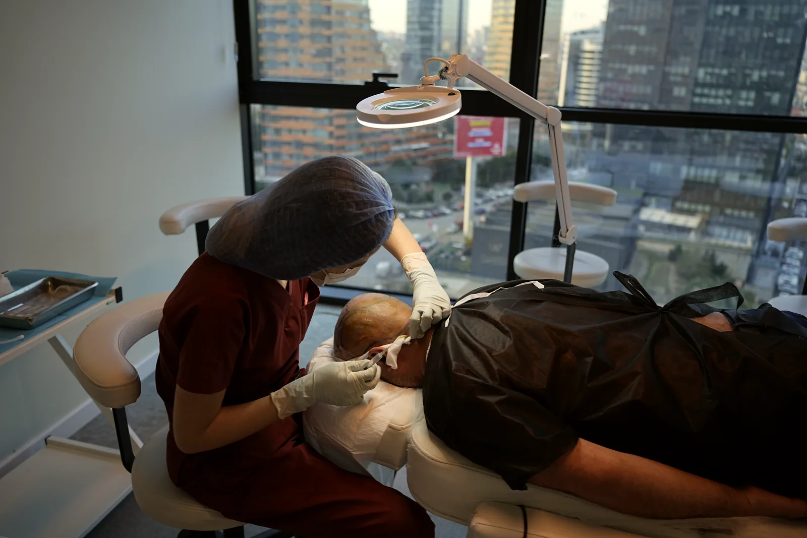 A patient at an Electivio partner clinic on the day of their hair transplant procedure in Turkey